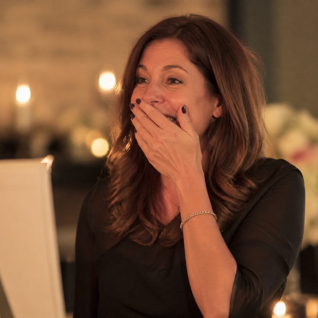 Woman surprised by a custom birthday song